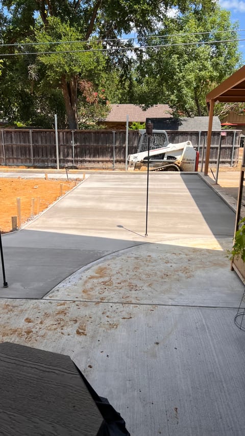 Cured concrete slab formed and finished