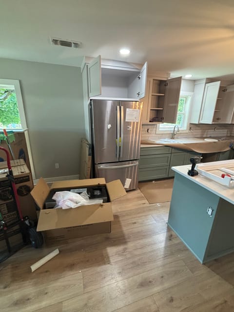 Kitchen with sage green island