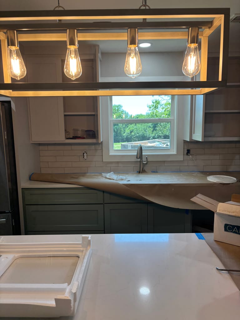 Brass edison bulb fixture over a custom vanity
