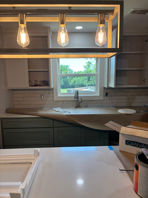 Brass lighting detail over vanity